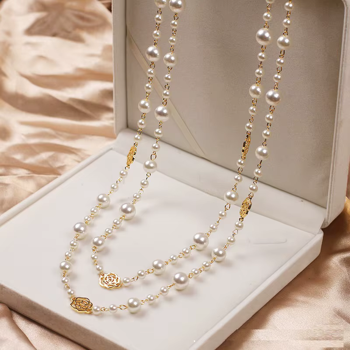 Elegant gold necklace with small pearl