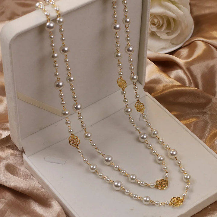 Elegant gold necklace with small pearl