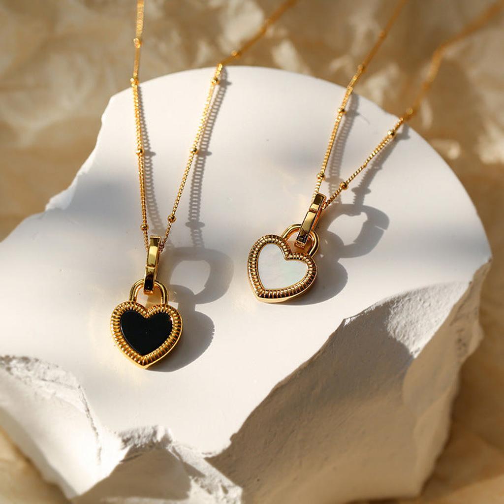 Necklace with Black and White Heart Pendant in Gold
