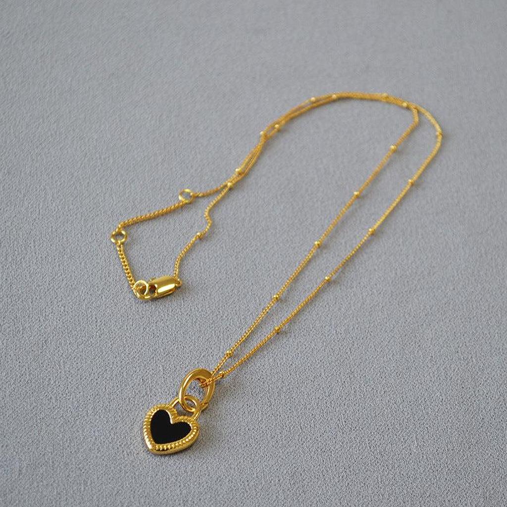 Necklace with Black and White Heart Pendant in Gold