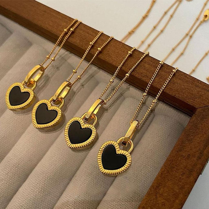 Necklace with Black and White Heart Pendant in Gold