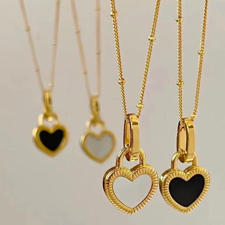 Necklace with Black and White Heart Pendant in Gold