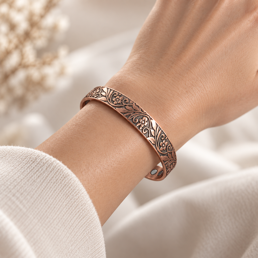 Copper bracelet with blooming vines