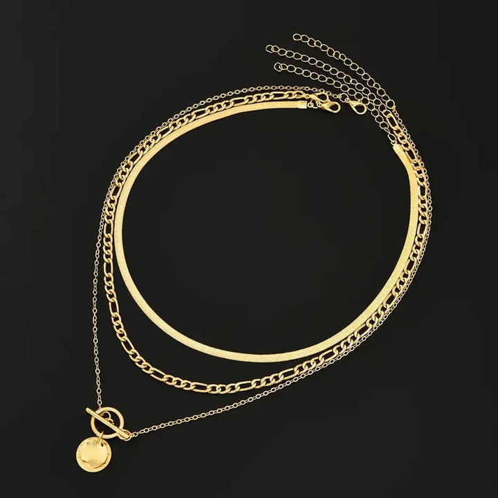 Multi-layered necklace with coins and texture