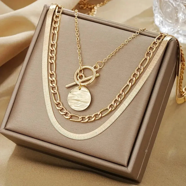 Multi-layered necklace with coins and texture