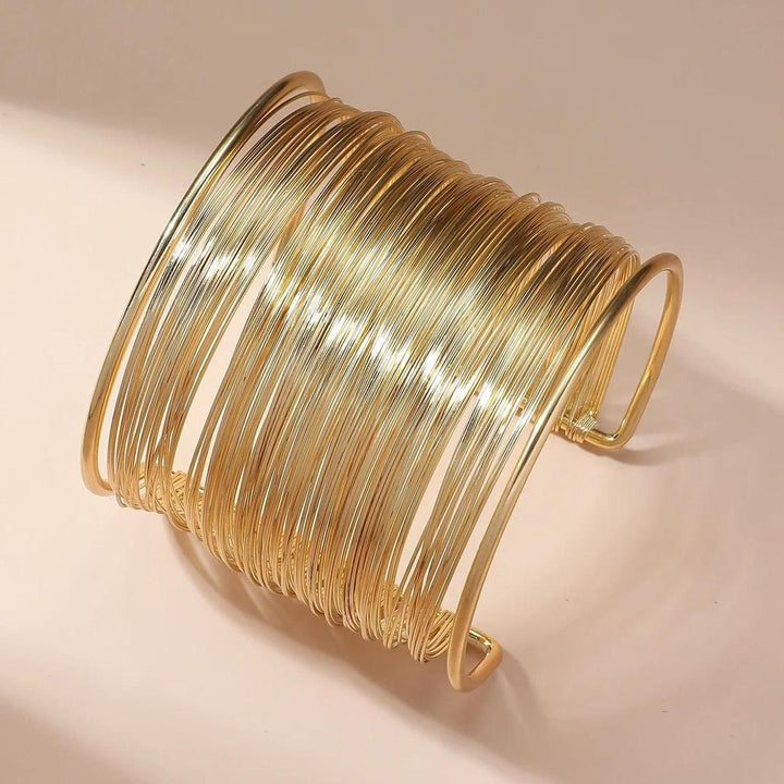 Open Bracelet with Spiral in Gold